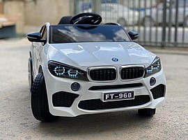 מכונית ממונעת + שלט 12V דגם BMW X6 לבנה מכונית ממונעת + שלט 12V דגם BMW X6 לבנה